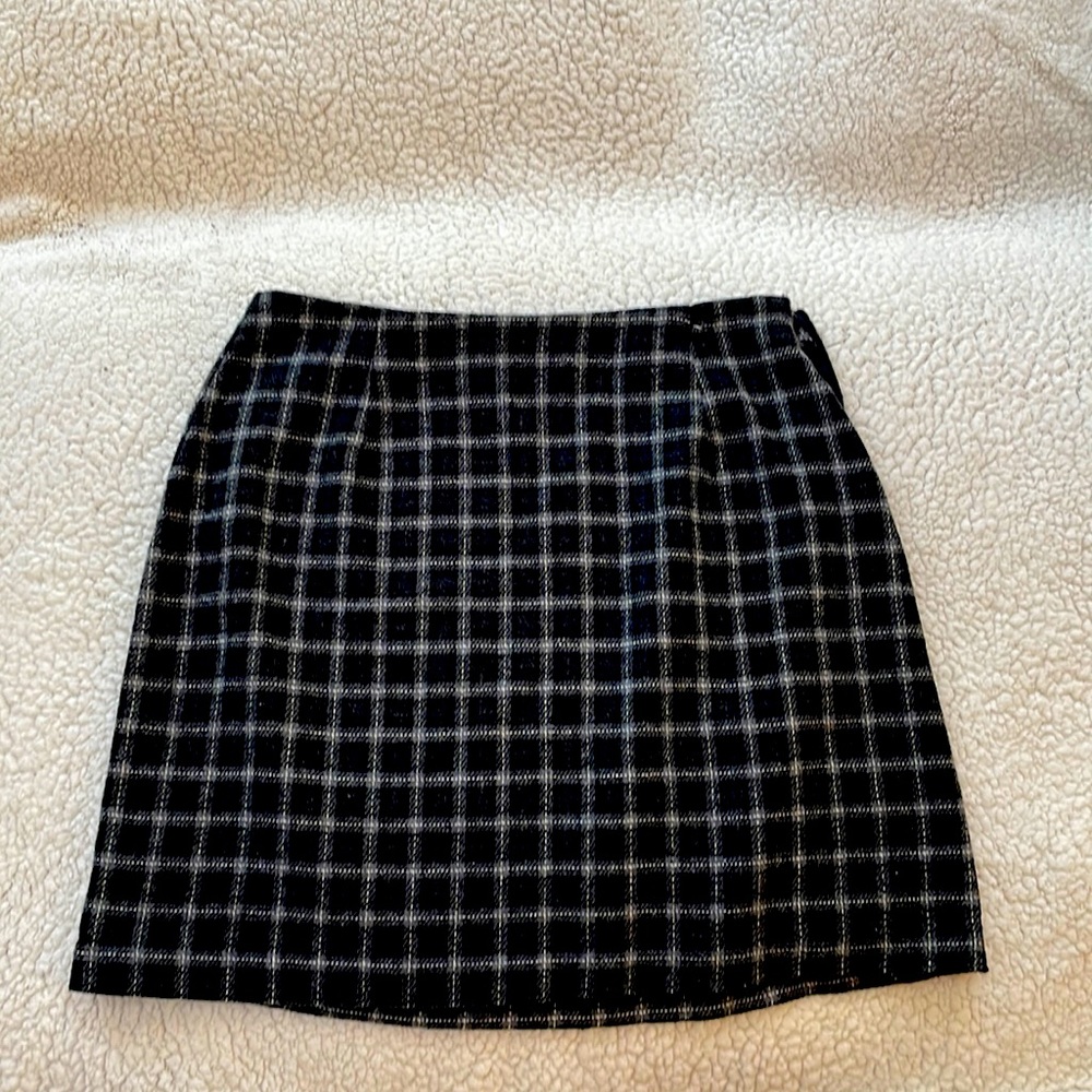 NYCC black skirt with grey and white plaid pattern.